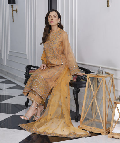 Marigold khaddi net embroidered 3-piece suit by Merakish with sequined detailing.