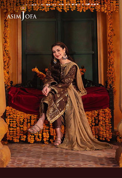 Elegant Pakistani cinnamon embroidered suit with matching twisted silk trousers