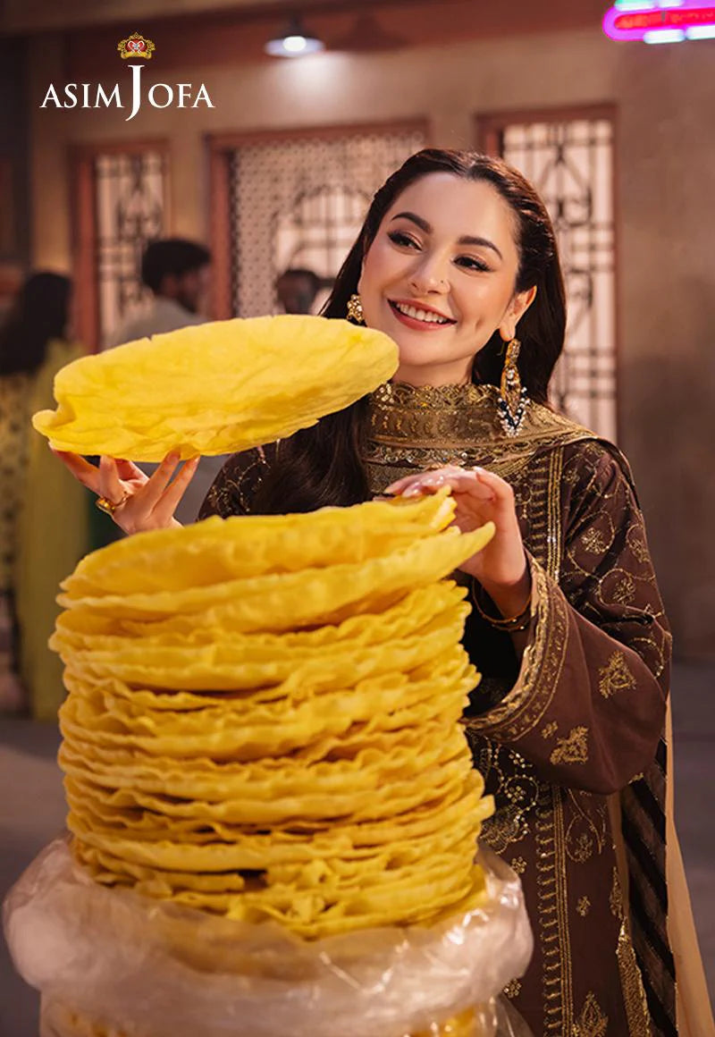 Asim Jofa’s cinnamon ensemble with gold zari and sequins