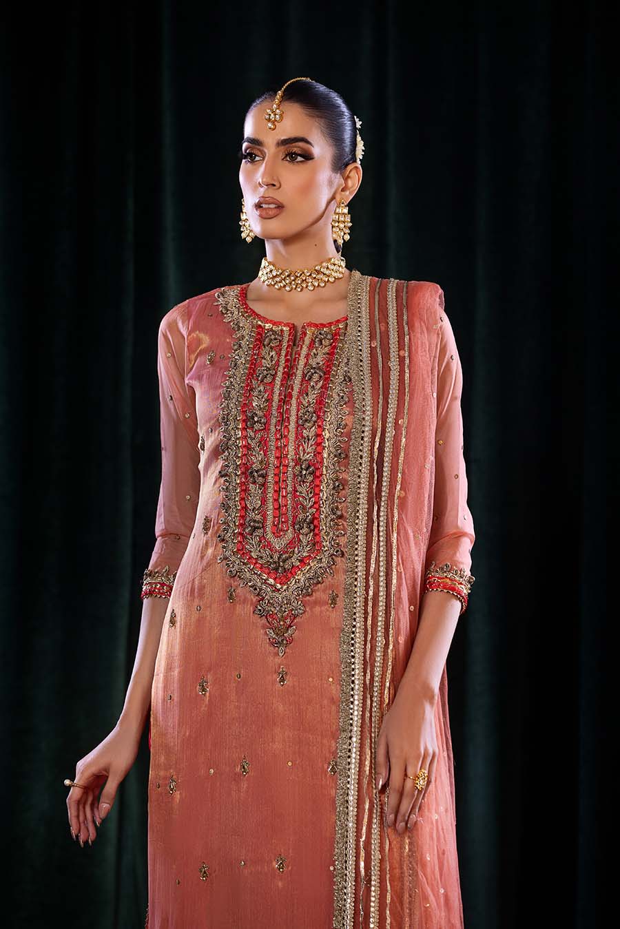 Model wearing full outfit, emphasizing traditional charm