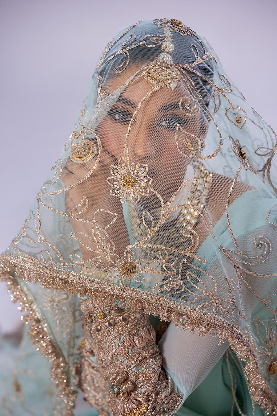 Model in full outfit, capturing elegant traditional style