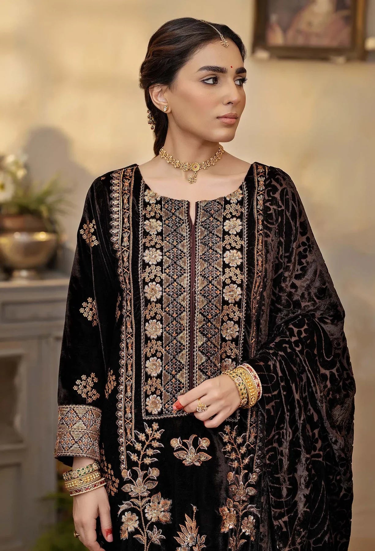 Elegant black velvet kameez with vibrant orange embroidery