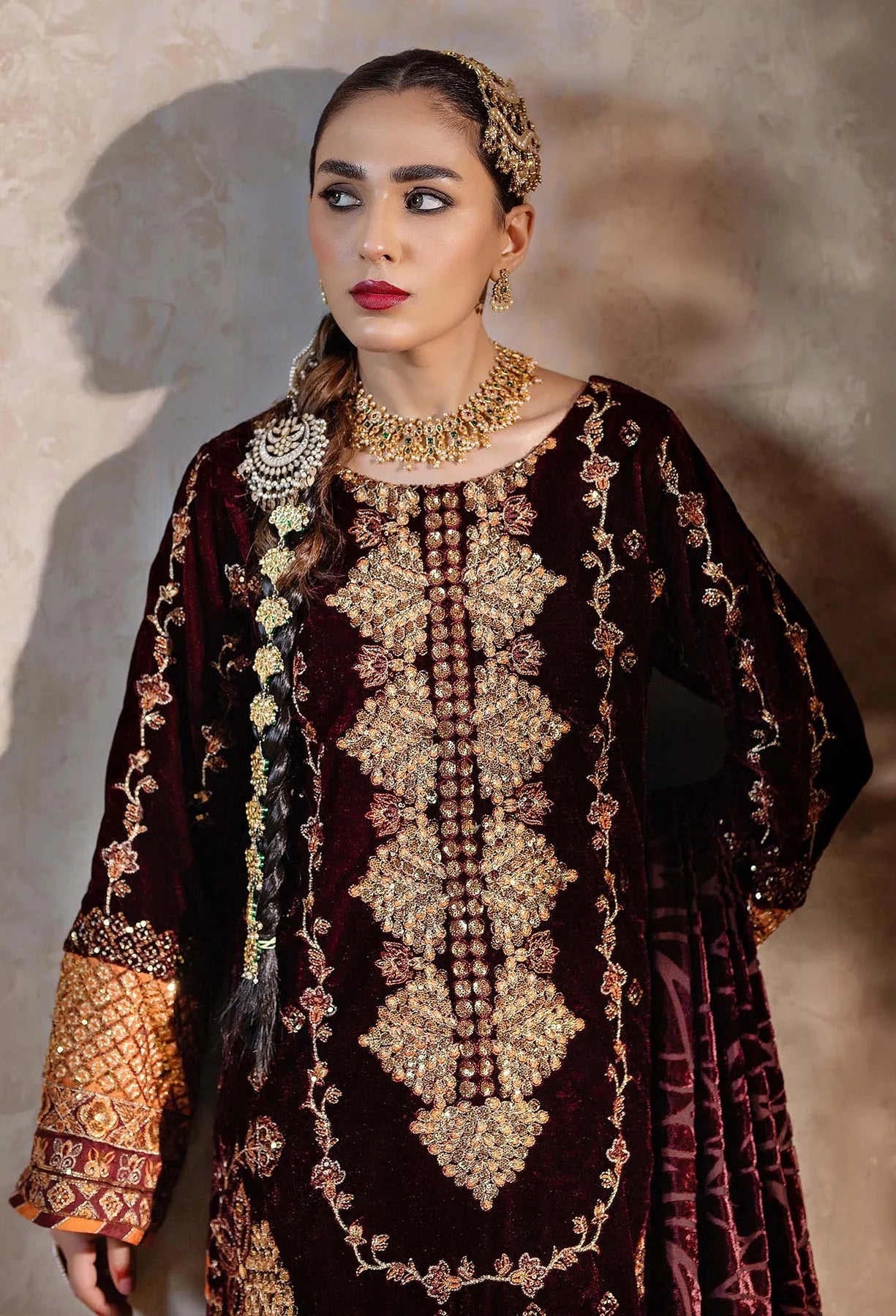 model wearing Maroon Embroidered Velvet Salwar Kameez with Velvet Shawl 