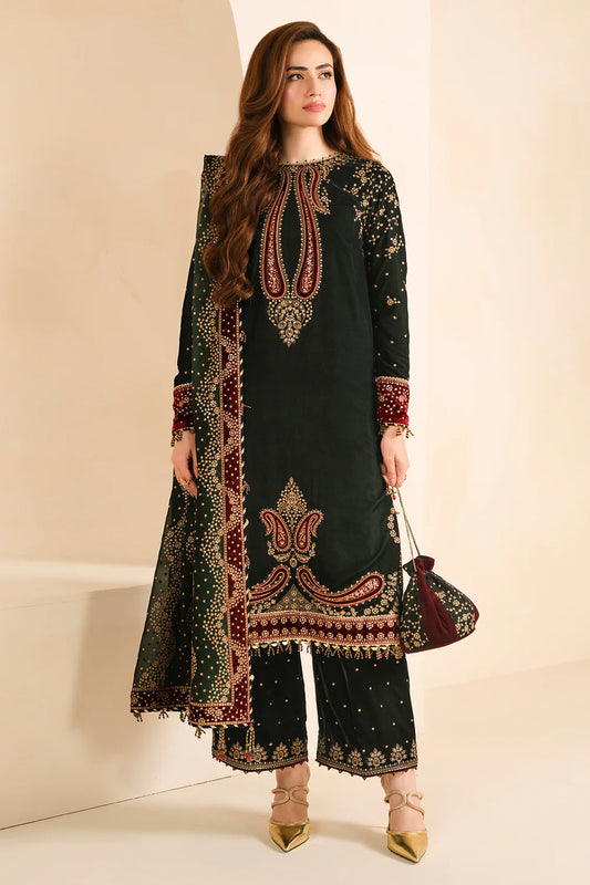 Front view of green embroidered velvet salwar kameez with georgette dupatta